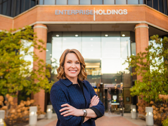 woman-smiling-in-front-of-building