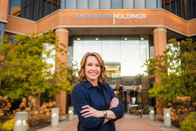 woman-smiling-in-front-of-building