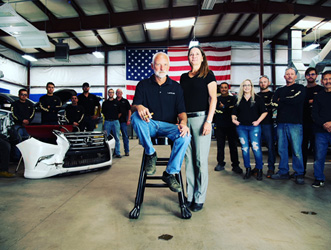 man-on-stool-surrounded-by-people